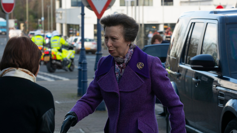 Princess Anne greeting woman on street