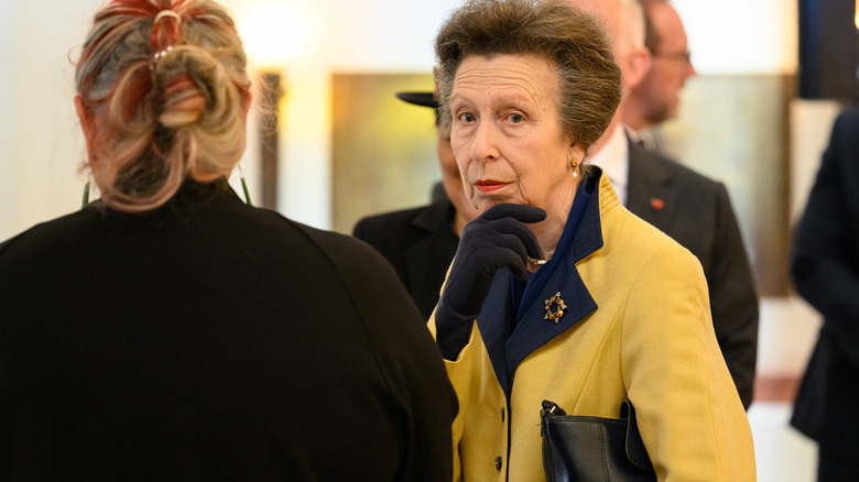 Princess Anne sitting with woman at event