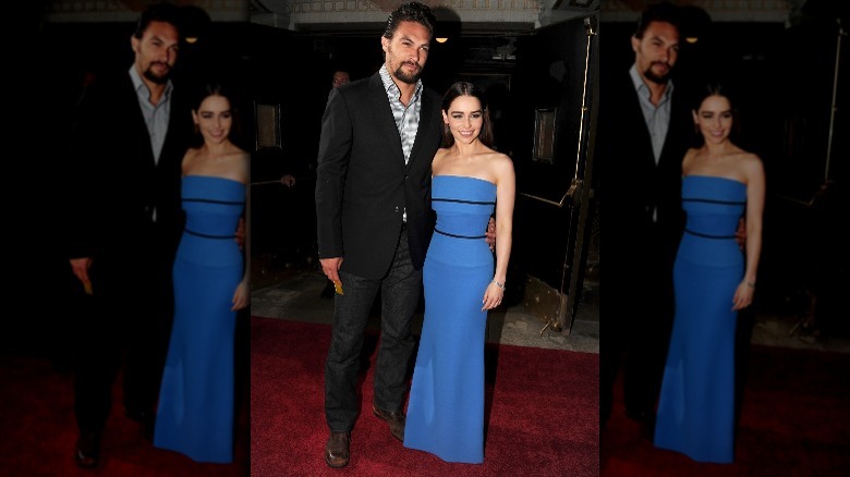 Emilia Clarke posing for a picture with co-star Jason Momoa 