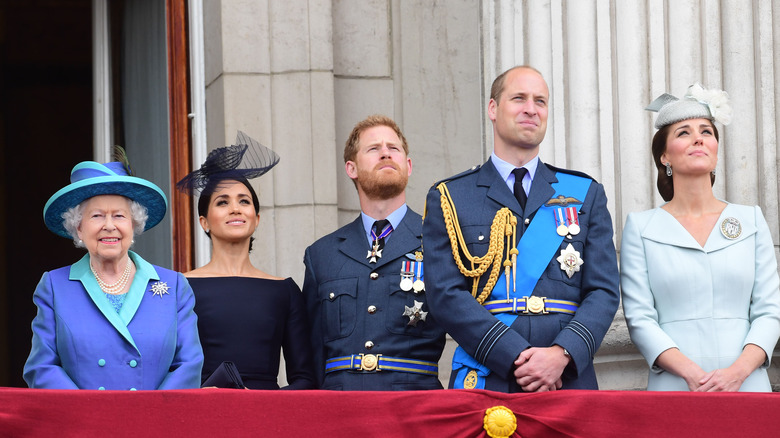 Queen Elizabeth with Meghan Markle, Prince Harry, Prince William, and Kate Middleton 