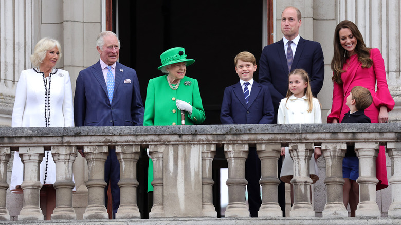 Prince George smiling with his family on the royal balcony