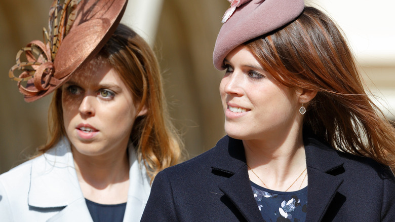 Princess Eugenie and Princess Beatrice looking sideways