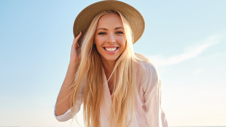 Woman at beach in hat