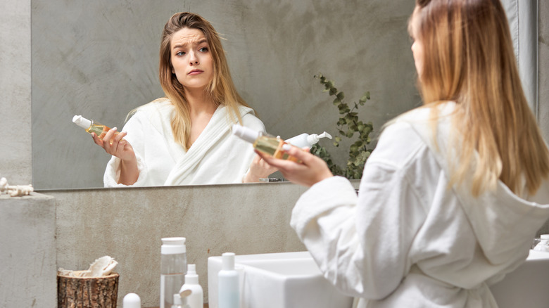 Woman holding skincare products