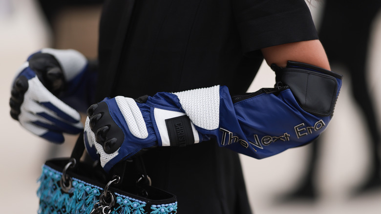 Woman wearing biker gloves