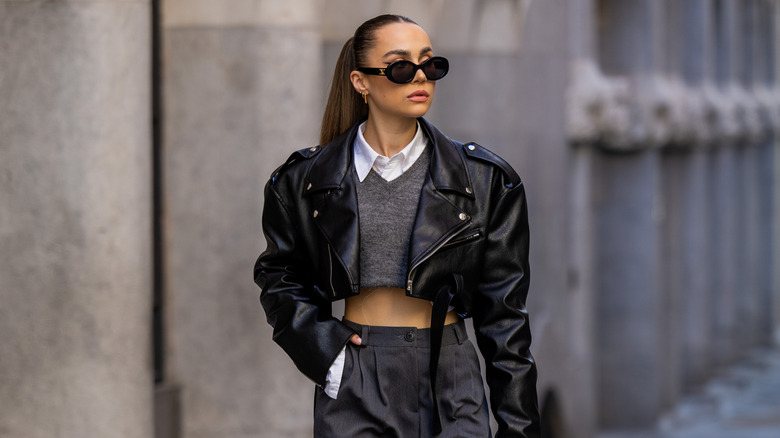 Woman wearing cropped biker jacket