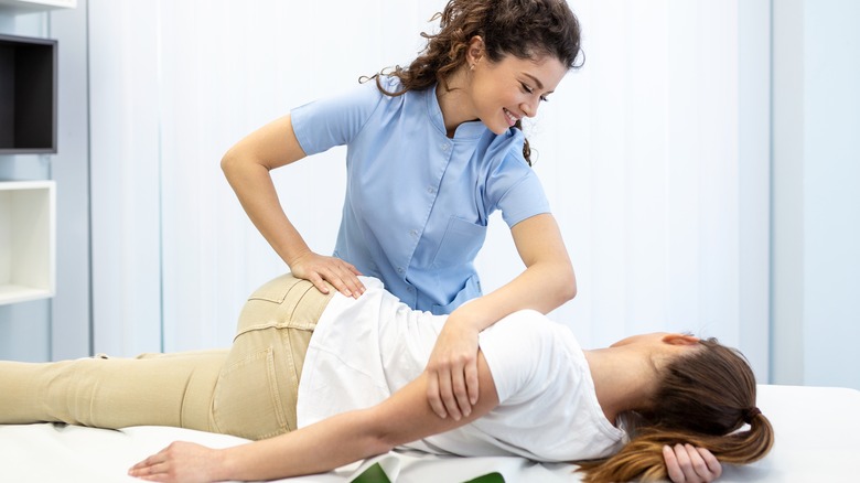 chiropractor adjusting a patient