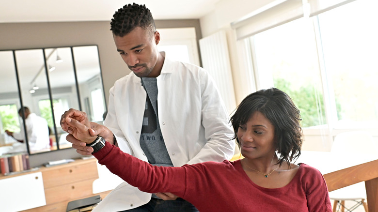 chiropractor with a patient