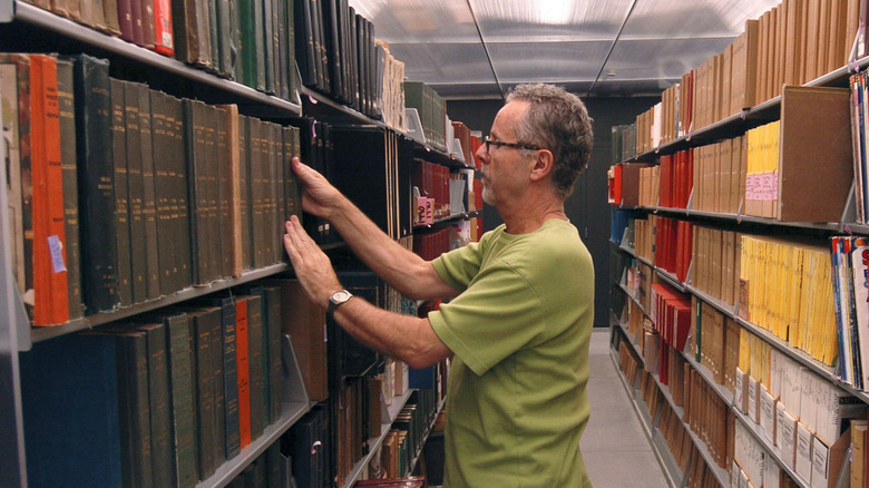 Librarian sorting books