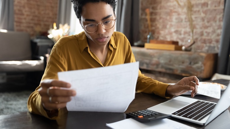 woman focused on paperwork 