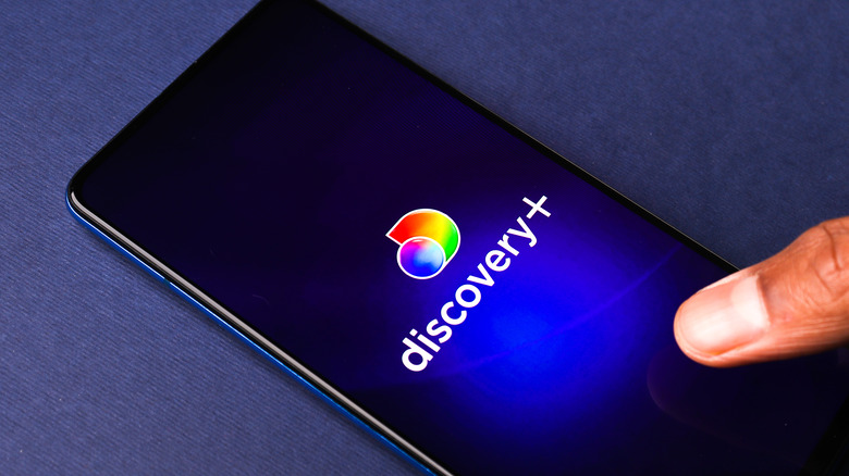 Discovery plus logo on phone screen