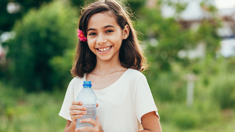 Girl holding water bottle