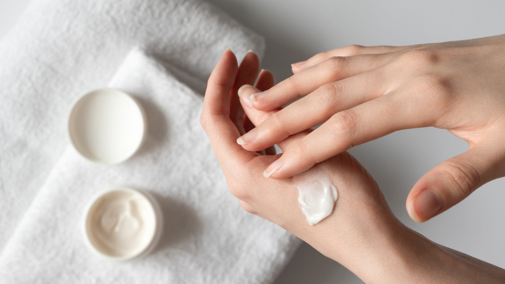 Lotion application on a woman's hands