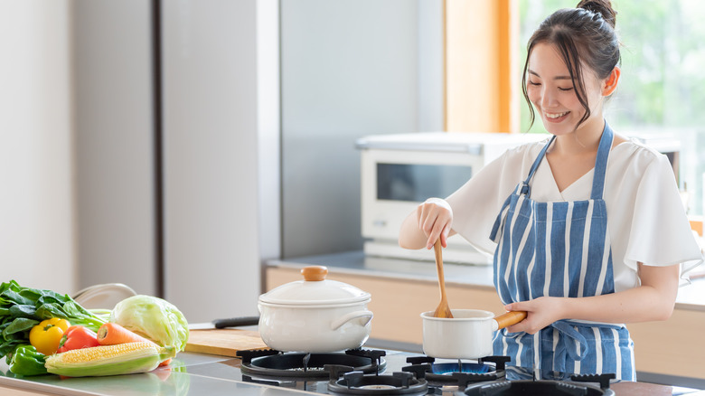 Woman stirring a pot