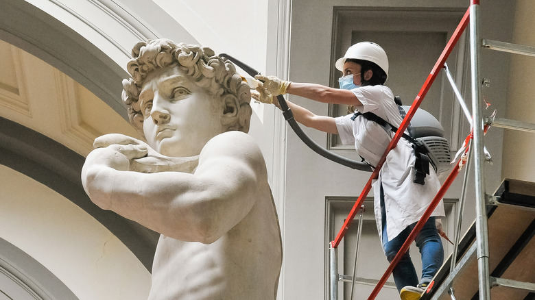 Worker cleaning Michelangelo's David