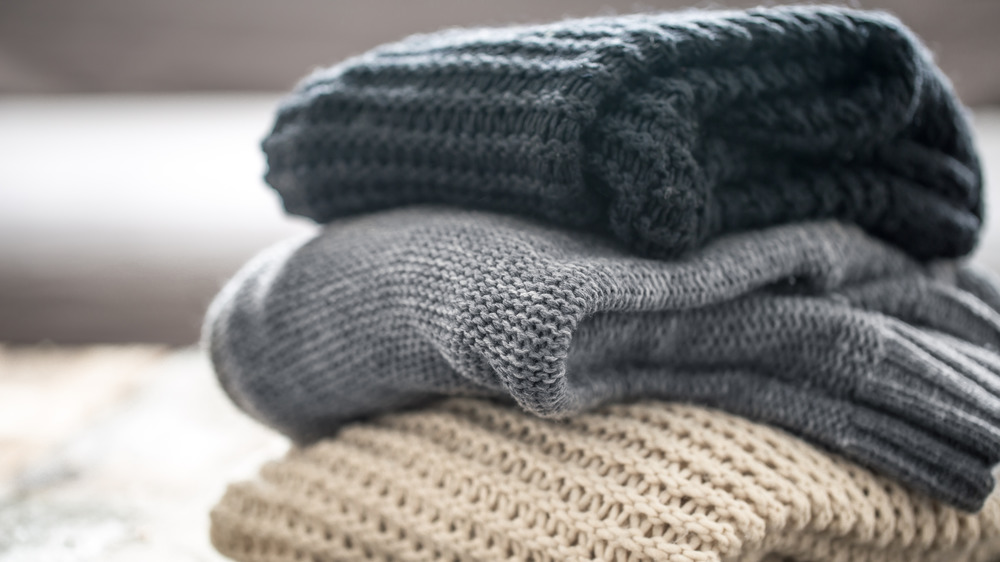 Stack of cozy knit sweaters