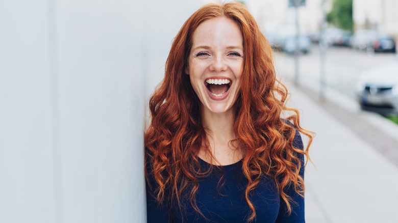 Woman with curly red hair