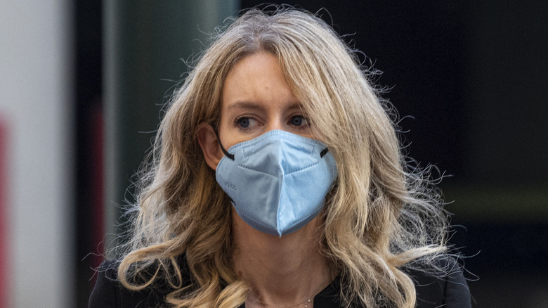 Elizabeth Holmes in a blue mask