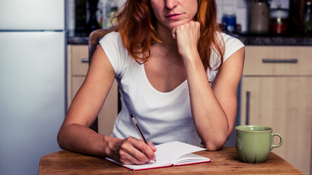 Woman writing a list