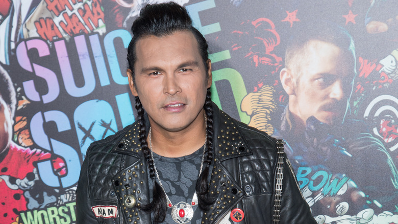 Adam Beach with a slight smile