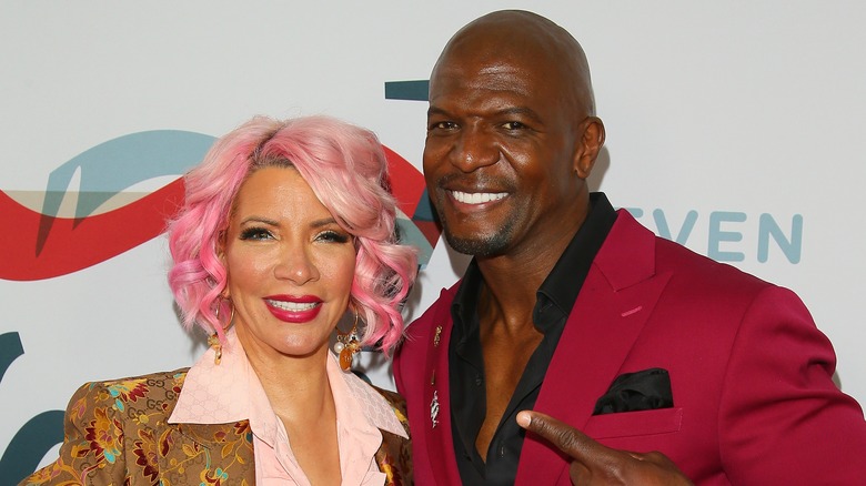 Terry Crews and Rebecca King-Crews pose on the red carpet together