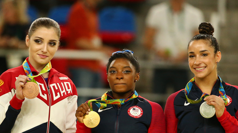 Aly Raisman proudly showing off her silver medal