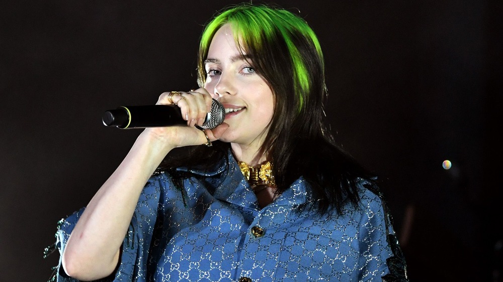 Billie Eilish holding a microphone 