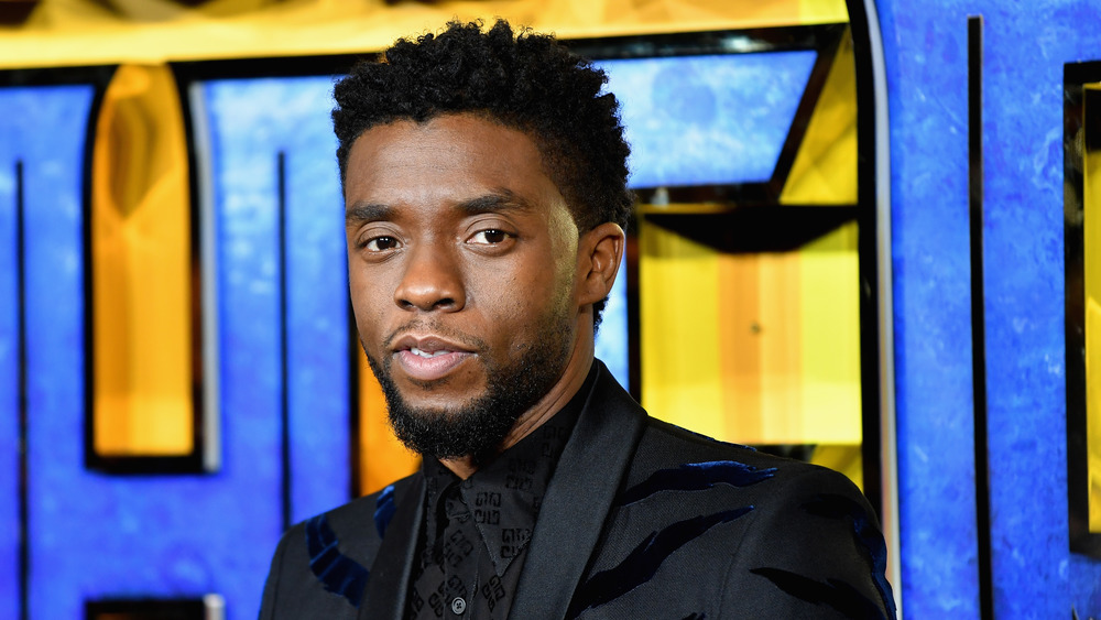 Chadwick Boseman poses at event for Black Panther