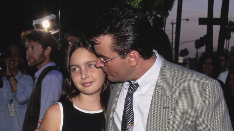 Cassandra Estevez and Charlie Sheen posing at movie premiere