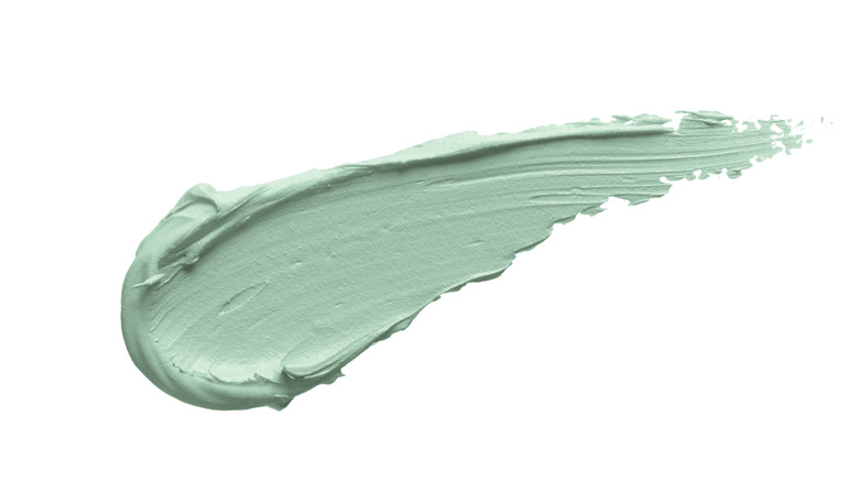 A swipe of green color-correcting concealer