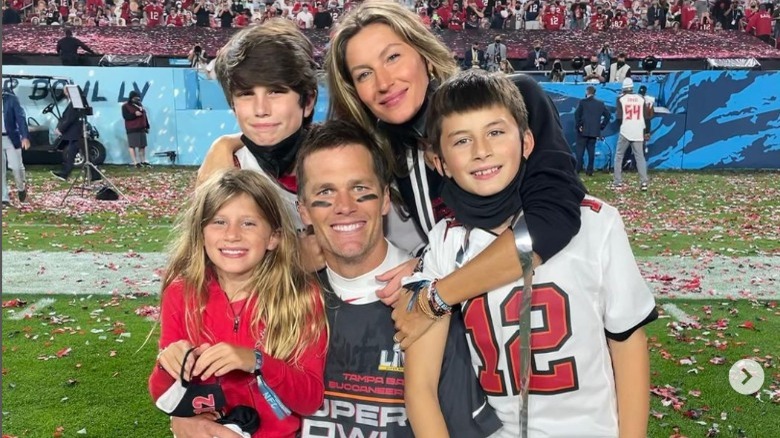 Tom and Gisele with their kids