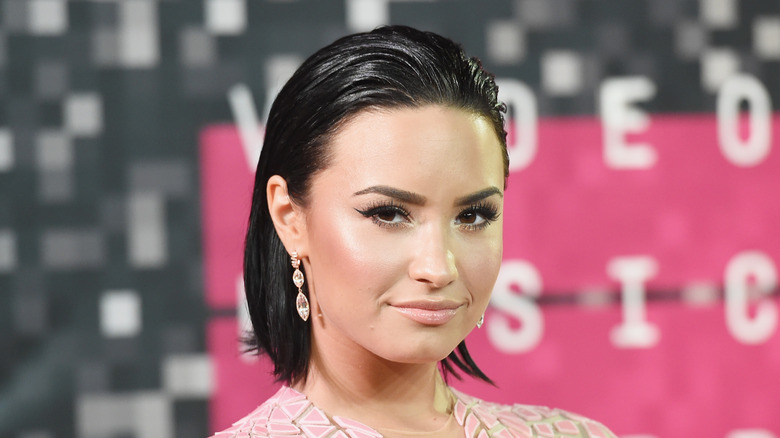 Demi Lovato poses on the red carpet