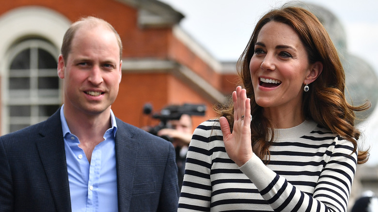 Prince William and Kate Middleton greet fans.