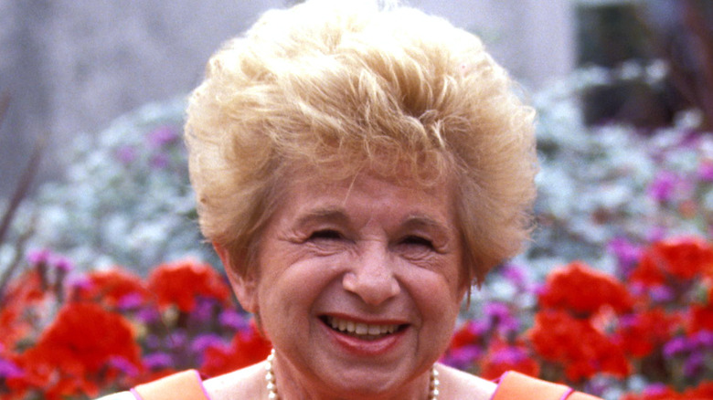 Dr. Ruth with flowered background 