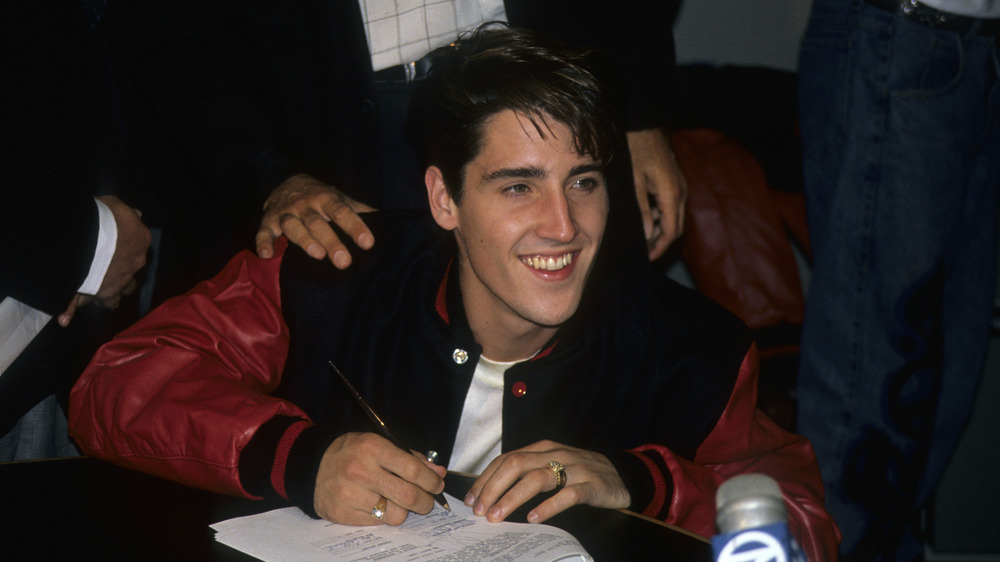 young Jonathan Knight smiling