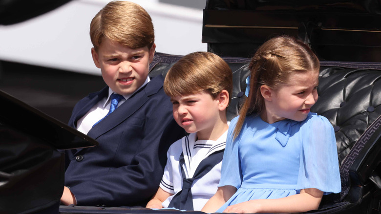 Prince Louis, Prince George, and Princess Charlotte in carriage
