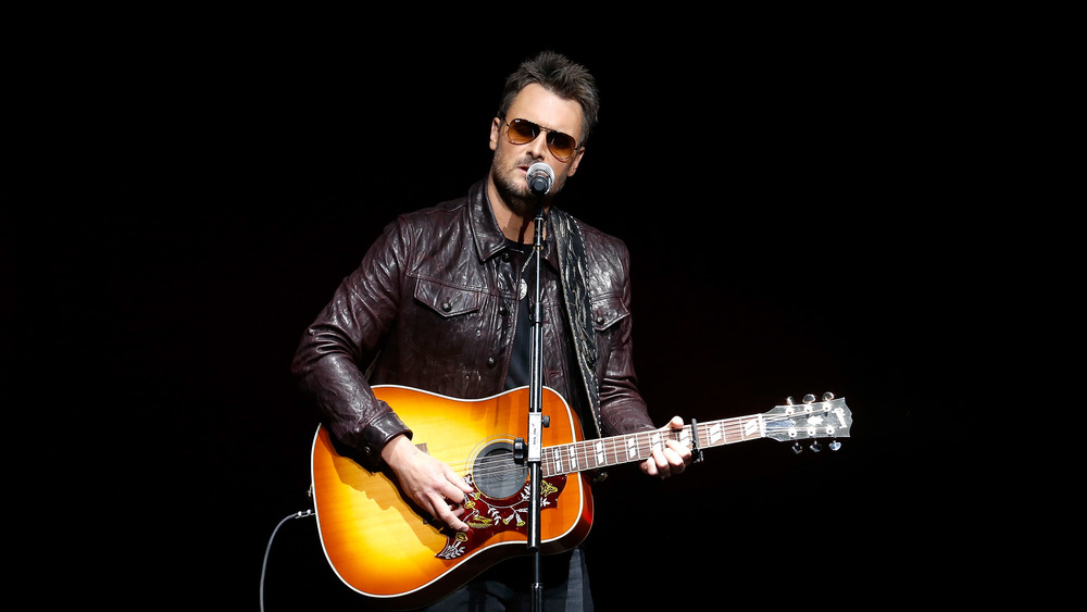 Eric Church singing with a guitar