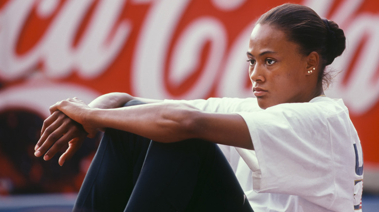 Marion Jones sitting on the floor