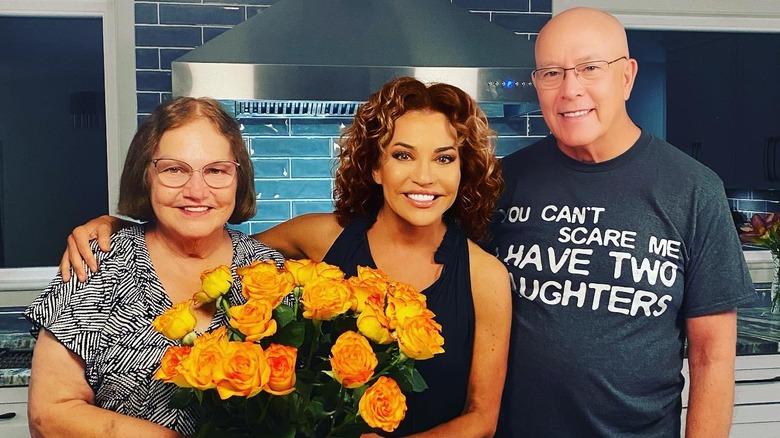 Robin Meade smiling with her parents