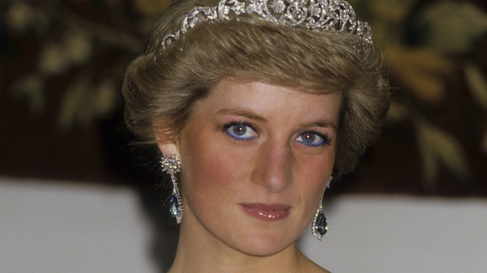 Princess Diana posing in crown