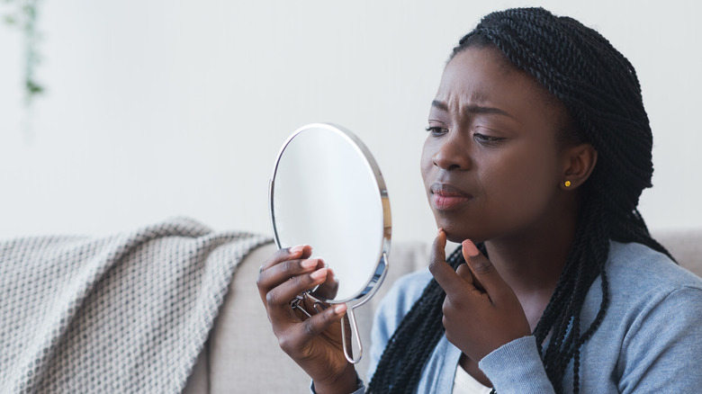 woman with face acne