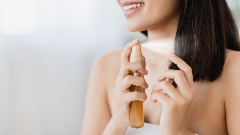 Woman using hair product