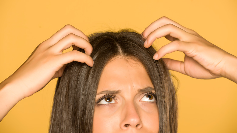 Woman with itchy scalp