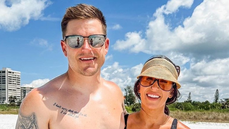 Cole and Chelsea DeBoer posing on the beach