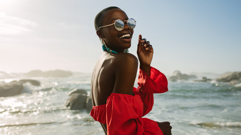 Woman at the beach smiling