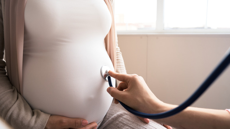 Pregnant woman and her doctor