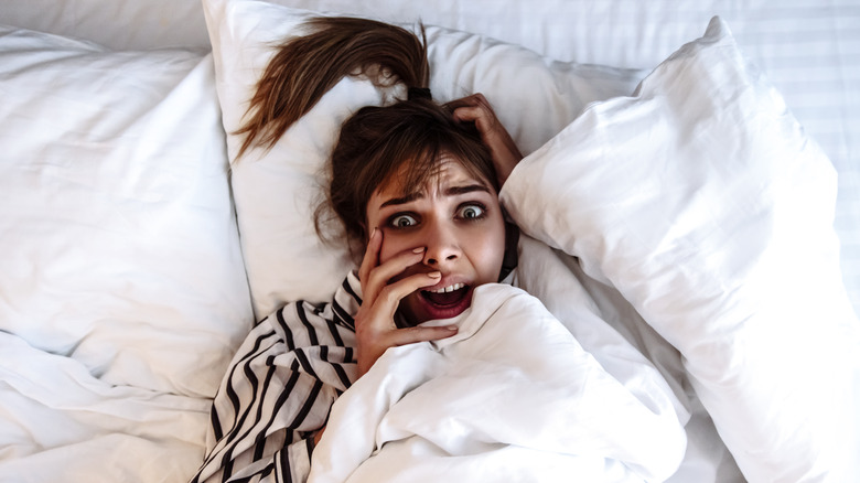 woman bed screaming