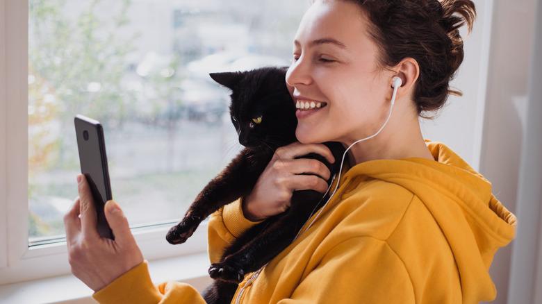 Woman with black cat