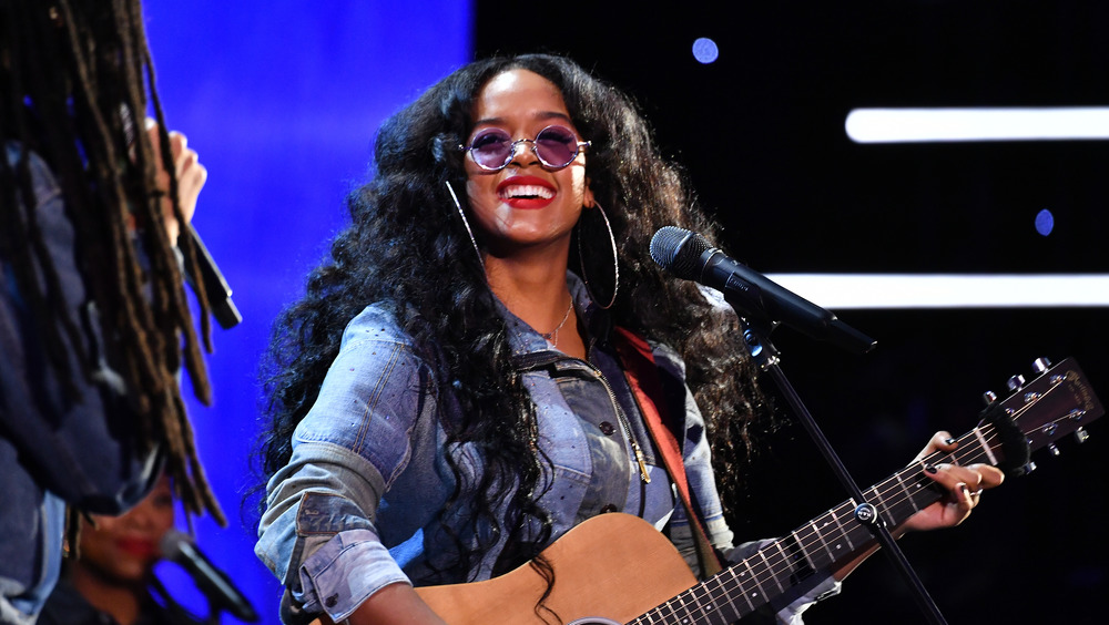 H.E.R. performing on stage