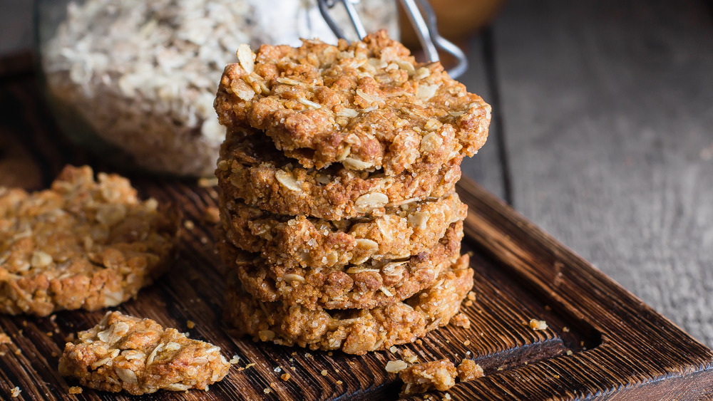 Oatmeal cookies stacked on a board